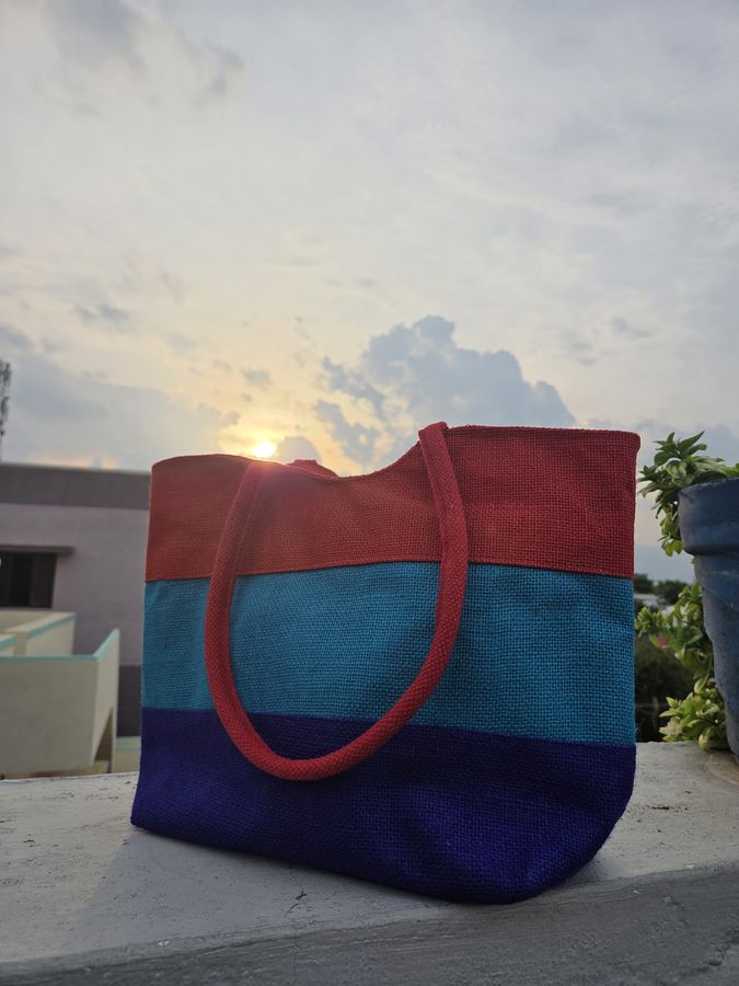 Handcrafted tri-colour jute bag at sunset in Theni